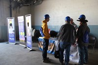 students talk to college representative at construction career day