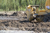 up close shot of equipment moving mud