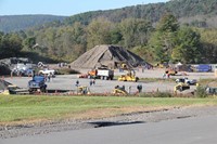 students watching a student work with equipment at construction career day