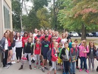 group of students during warrior welcome stand with principal mary beth hammond in front of chenango