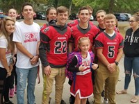 high school student athletes welcome elementary students to school during warrior welcome