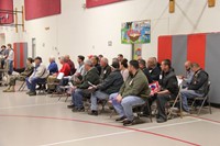 veterans sitting holding thank you cards