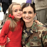 mother smiling with daughter