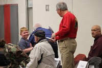 boy giving veteran thank you card