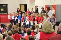 far shot of students reading patriotic poem