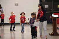 students walking up to read poem