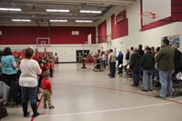 wide shot of color guard leaving assembly