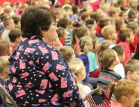 teaching holding flags wearing american flag shirt