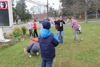 wide shot of students planting flags