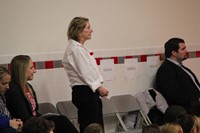 woman from american legion standing up while being recognized