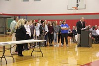 girls swim team at fall sports awards