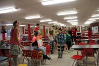 middle school students walking through trashion show