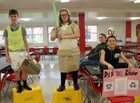 students dressed in recyclable items for trashion show