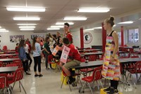 students in middle school cafeteria for trashion show