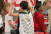 students cape made with old broken cds