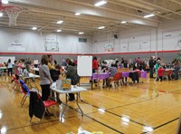 wide shot of the middle school gym filled with people for humanities night