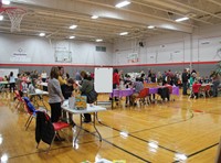 wide shot of the middle school gym filled with people for humanities night