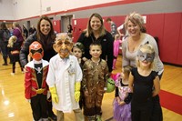 group of parents with students dressed in costumes