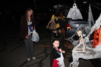 child dressed up at trunk or treat event
