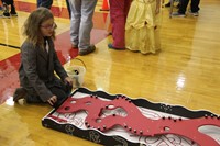 girl playing maze type of activity