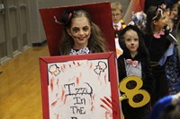 students parade around gym