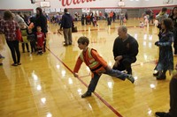 student throwing ball for activity