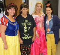 four chenango bridge staff members dressed up for halloween