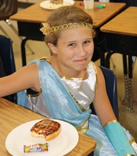 student smiling dressed as warrior