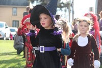 little girl dressed as a witch