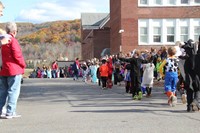 long line of students in halloween parade
