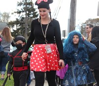 students walking with teacher in parade