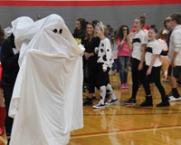 student dressed as ghost for middle school costume contest