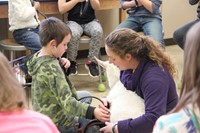 boy listens to goats heart using stethescope