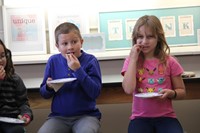 students take a bite of another cheese