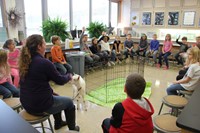 representative in classroom with goat and students