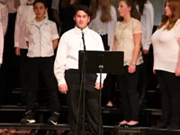 students talking on stage at concert