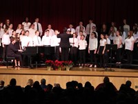 seventh and eighth grade students singing