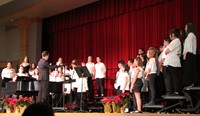 sixth grade chorus singing on stage