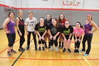 high school volunteers with zumba instructors