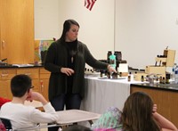 woman demonstrating essential oils