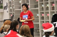 woman talking to students about iron man tournament