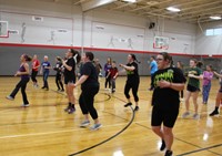 students doing zumba in gym