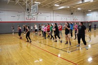 far shot of students salsa dancing