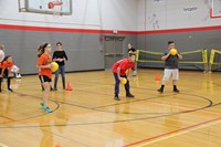 students playing dodgeball in gym
