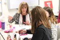 students paint nails