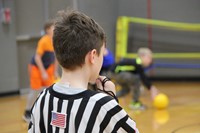 student ref blowing whistle.