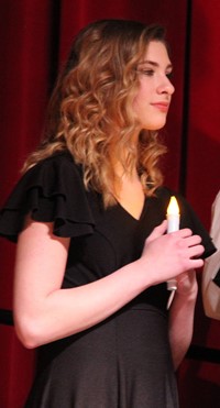 girl holding candle