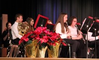 holly in front of students playing instruments