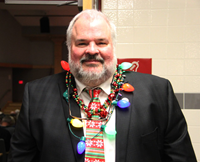 man wearing lightbulb necklace