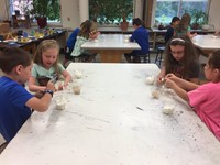 students from summer steam program working on marshmallow towers